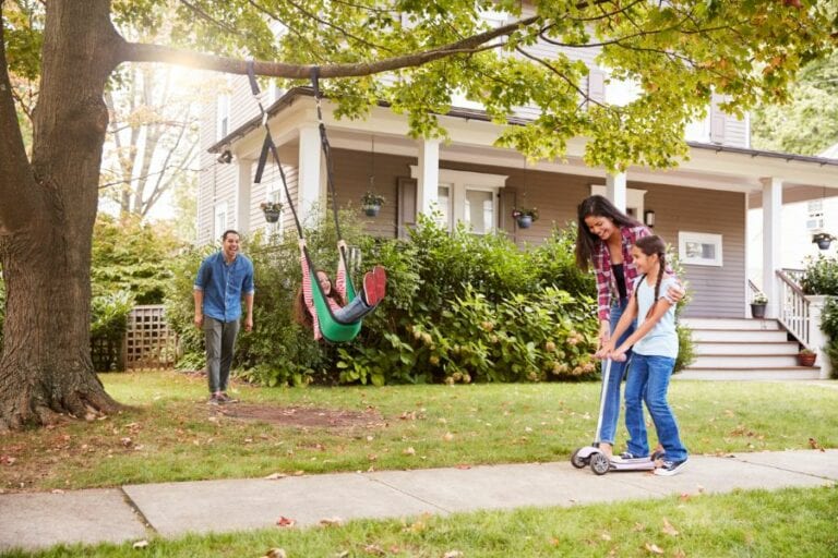 Family Playing in Front Yard