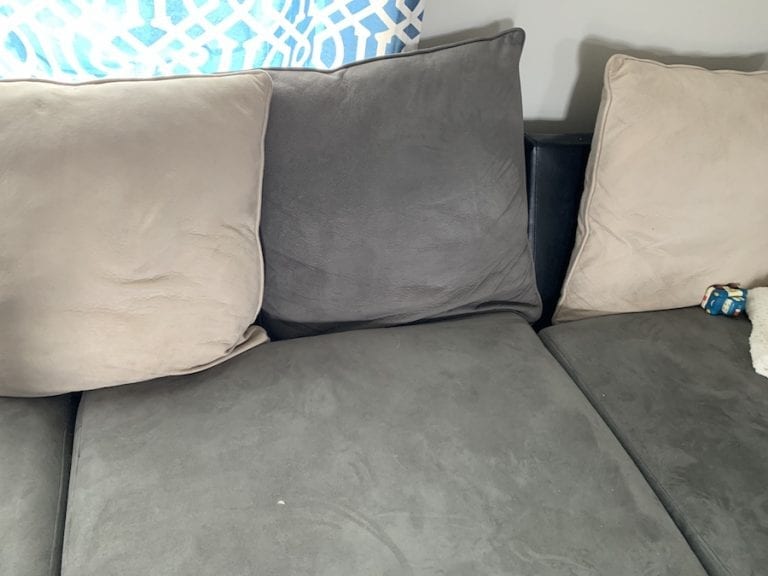Couch with sliding cushions