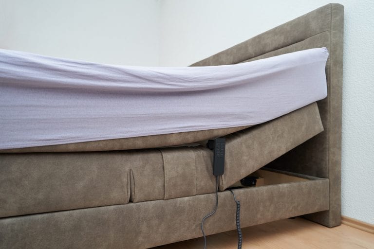 Bed with tilt adjustment mattress bed in the bedroom