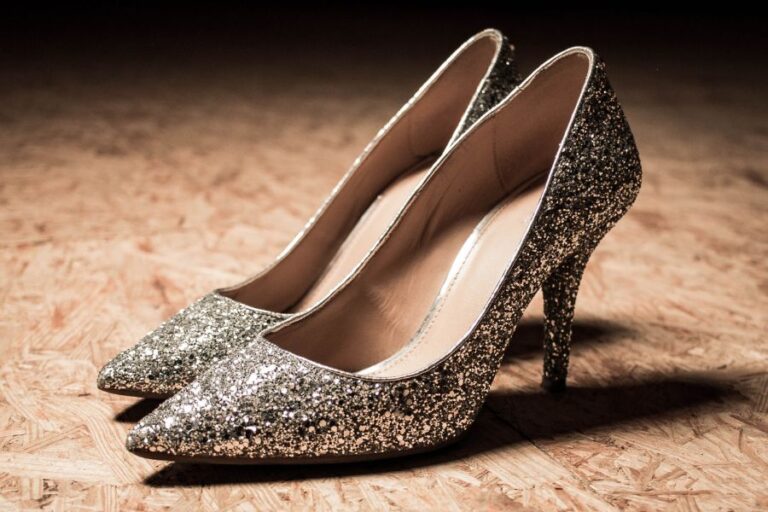 Glittered High Heels Sitting on Plywood Board