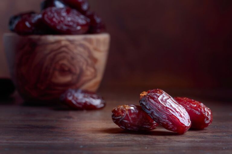 Dates on Table and in Bowl on Wooden Table