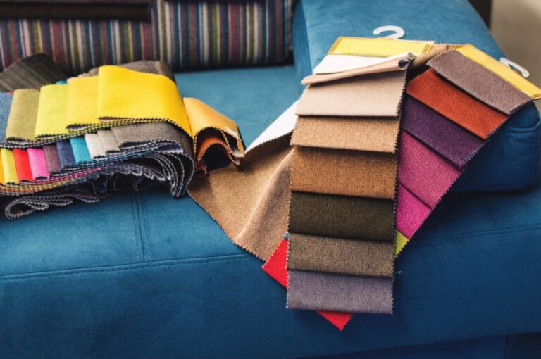 Colorful Upholstery Fabric Samples on Blue Couch