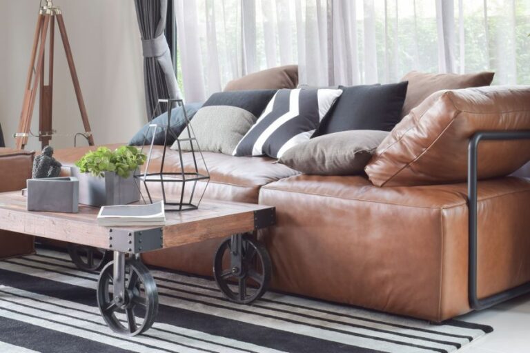 Industrial Style Table With Brown Leather Couch