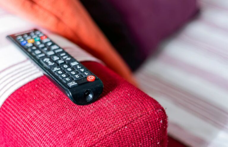 A Dusty Remote on the Arm of a Pilling Couch