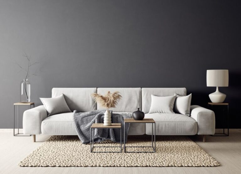 Light Colored Low Sofa With Tables and Decor