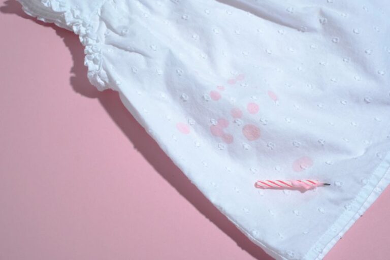 White Shirt With Pink Birthday Candle Wax Stains