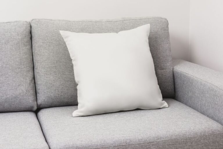 White Throw Pillow on a Gray Couch