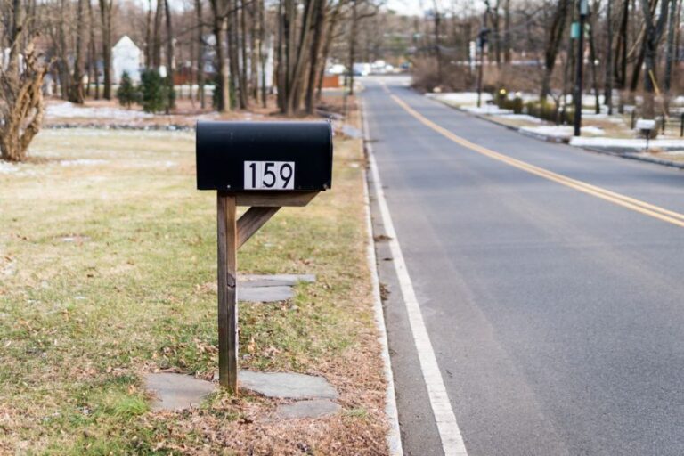 Black Mailbox Along Two Lane Road
