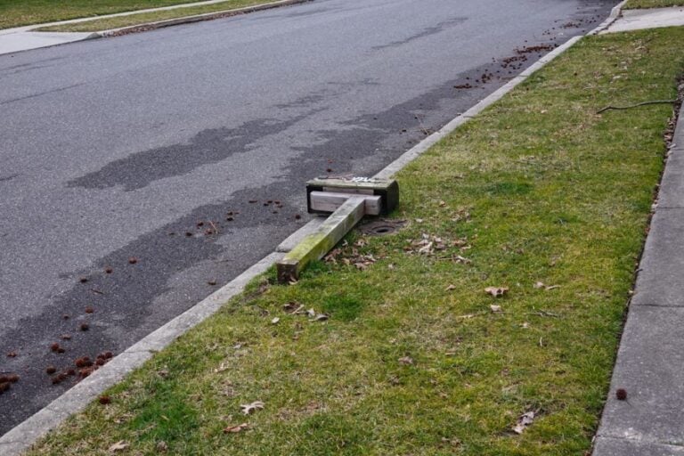Mailbox Hit by Car Laying on the Ground