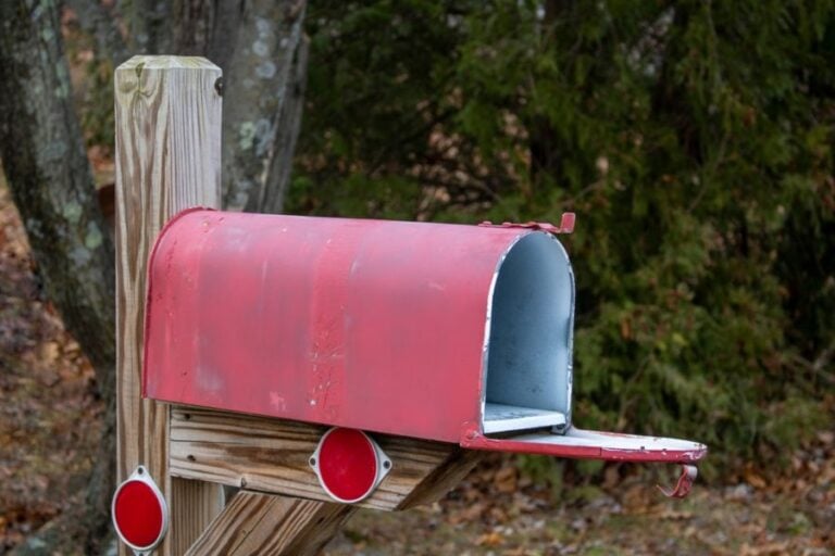 Open Red Painted Mailbox in a Suburb