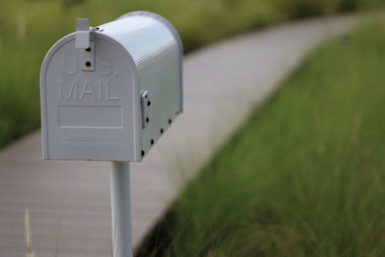 White Mailbox at the End of a Walkway