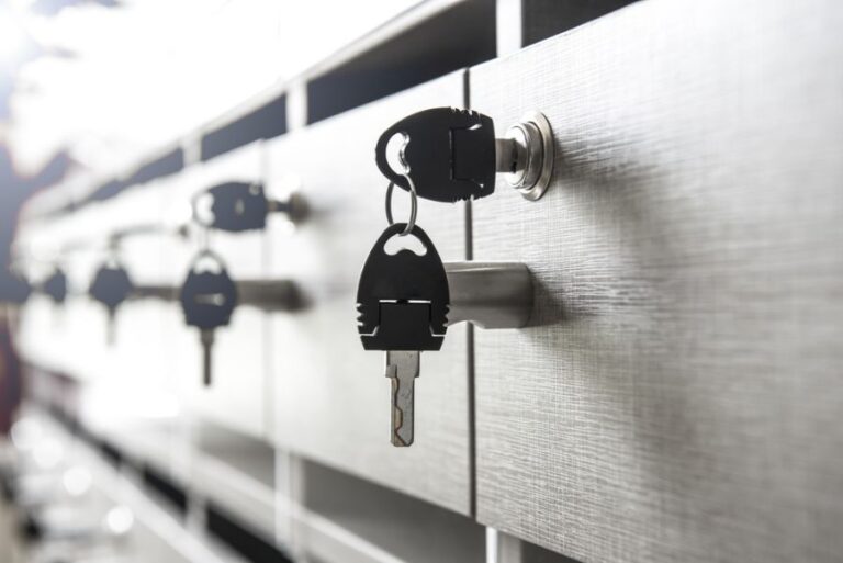 Black Keys Hanging From the Locks of a Set of Apartment Mailboxes