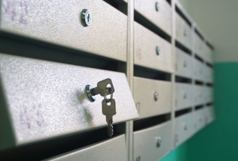Keys Hanging From the Lock of an Apartment Building Mailbox