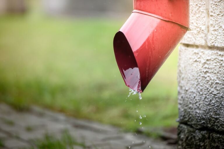 Rain Water Flowing Out of a Drainpipe