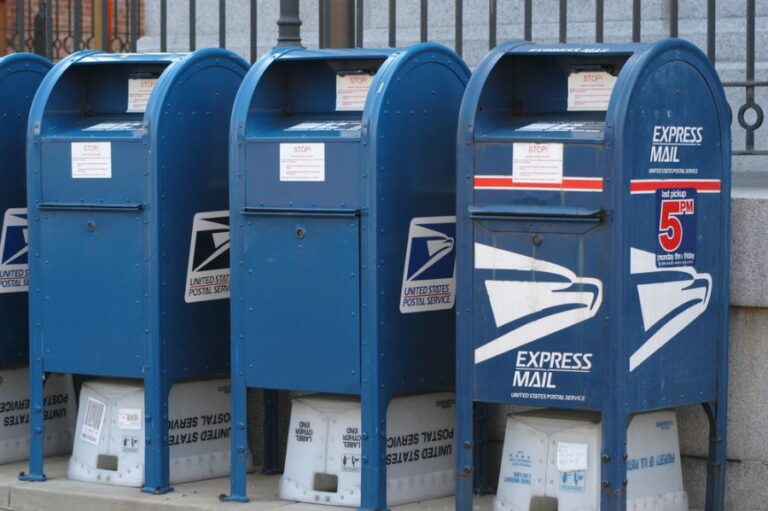 Three Blue Postal Service Mailboxes in a Row