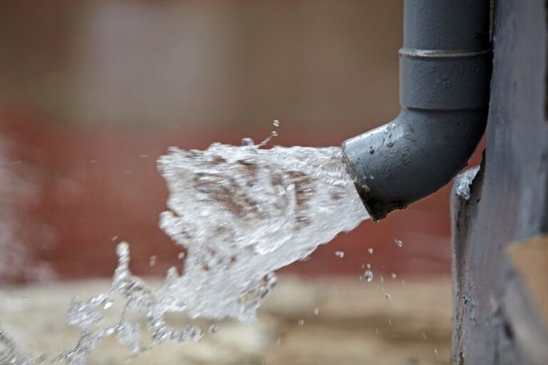 Water Draining Quickly Out of a Downspout