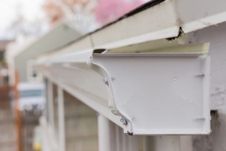 Closeup of White Rain Gutters on a Roof