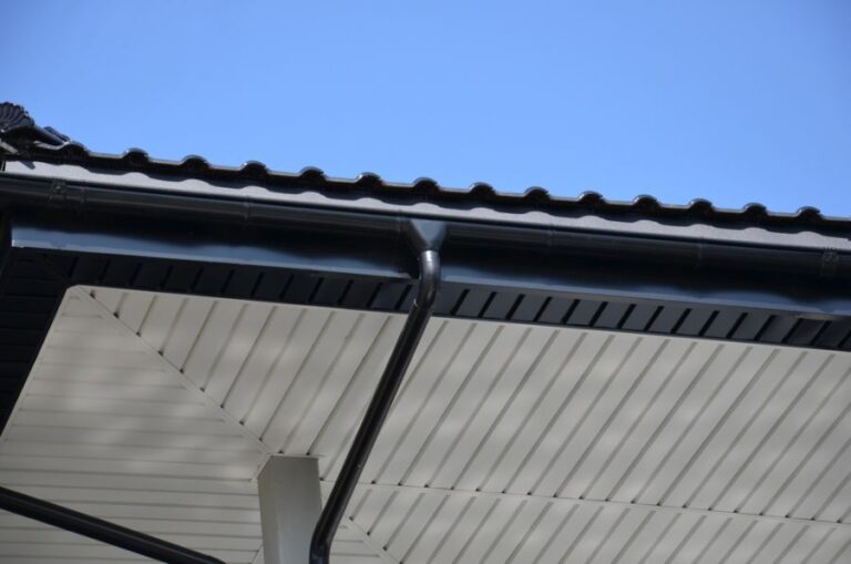 Black Metal Gutter System on a Roof