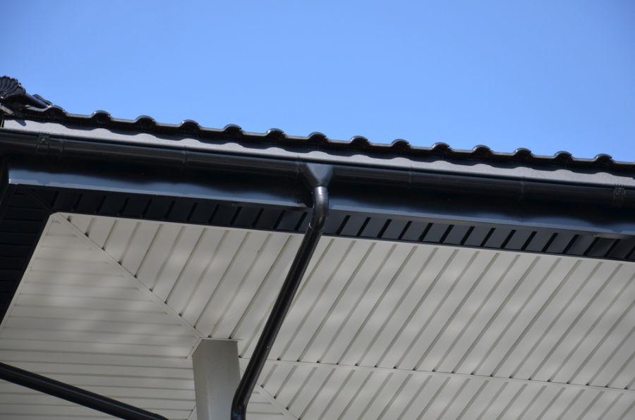 Black Metal Gutter System on a Roof