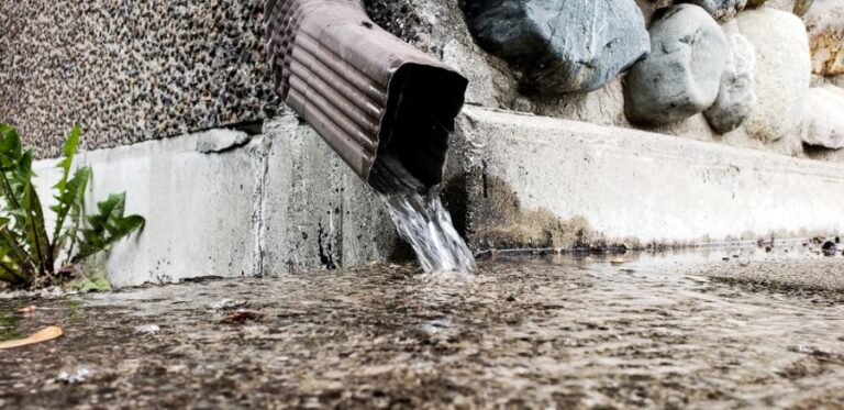 Rainwater Pouring From Downspout