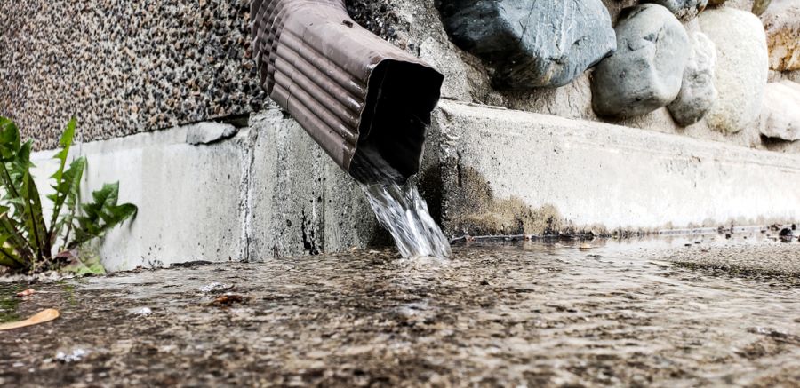Rainwater Pouring From Downspout