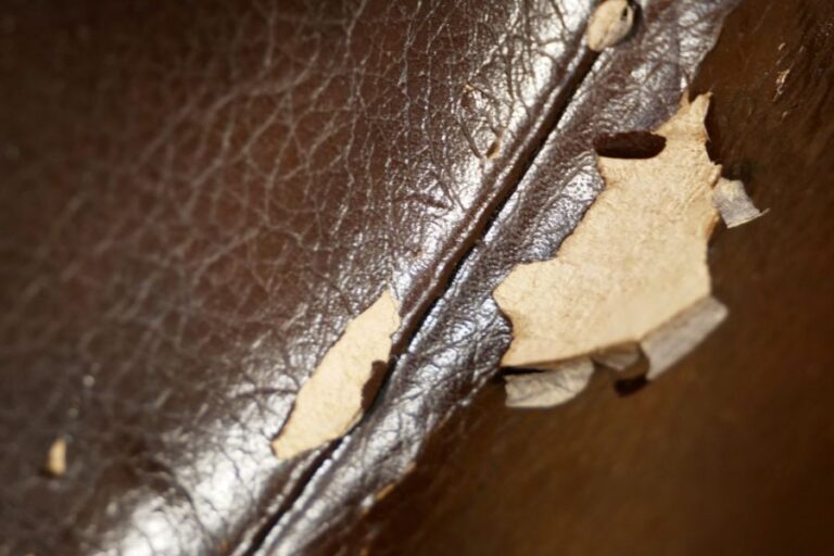 Brown Faux Leather Couch With Peeling Spots