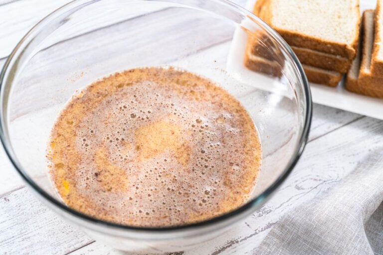 French Toast Batter With Bread in the Background