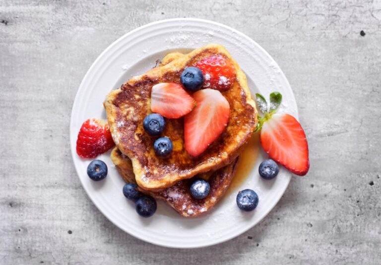 French Toast With Syrup and Fruit Toppings