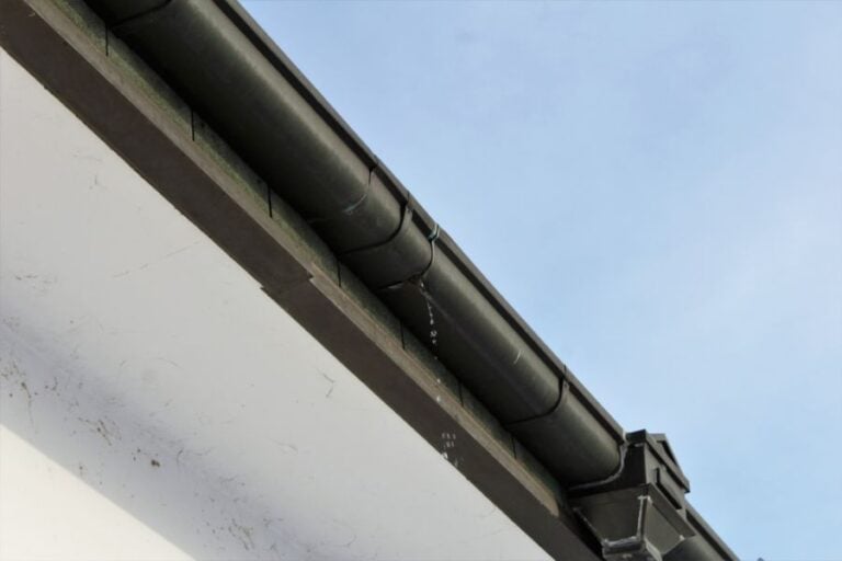 Black Gutters With a Leak