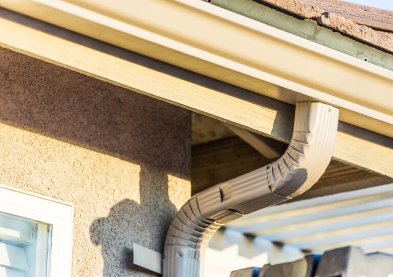 Closeup of Aluminum Gutters on the Roof of a House