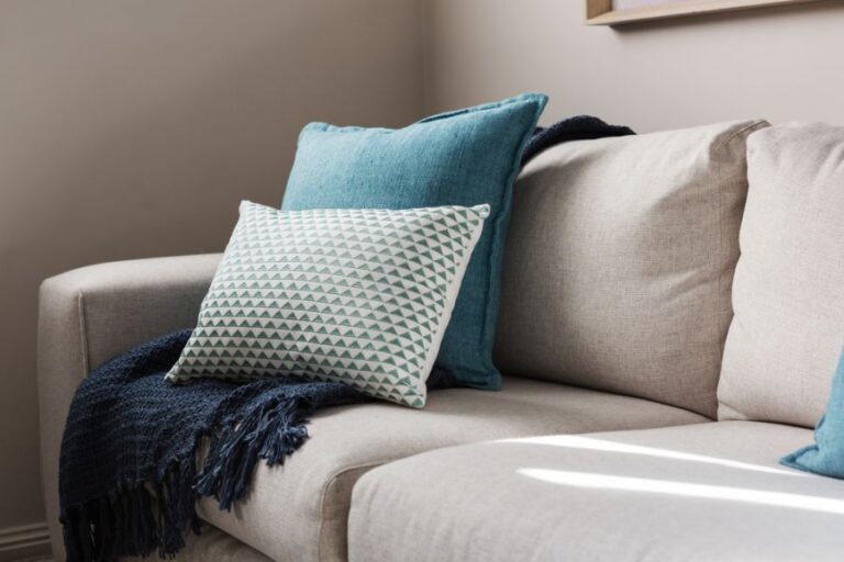 Closeup of a Comfortable Couch With Throw Pillows and a Blanket
