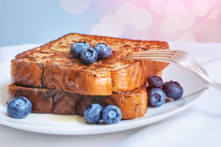 French Toast With Blueberries on a White Plate