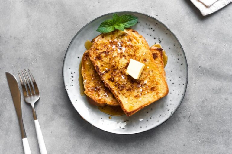 French Toast With Honey Syrup and Butter on a Plate