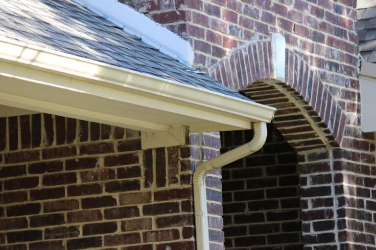Roof of a Brick House With Rain Gutters