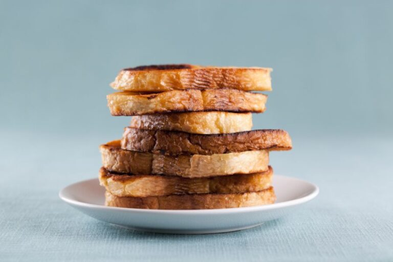 Stack of Leftover French Toast on a White Plate