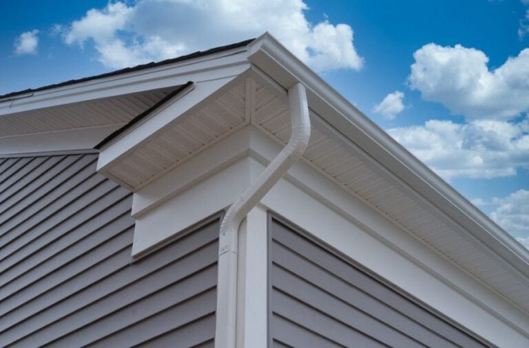 White Gutters on the Roof of a Gray House