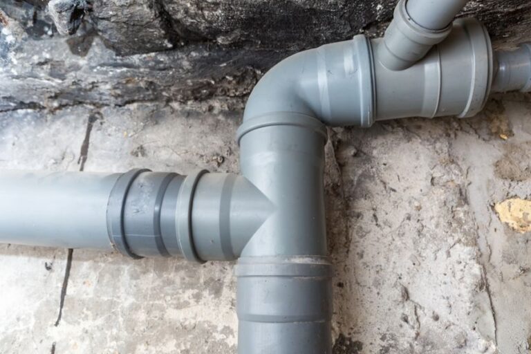 Gray Sewer Pipes in a Basement or Crawl Space