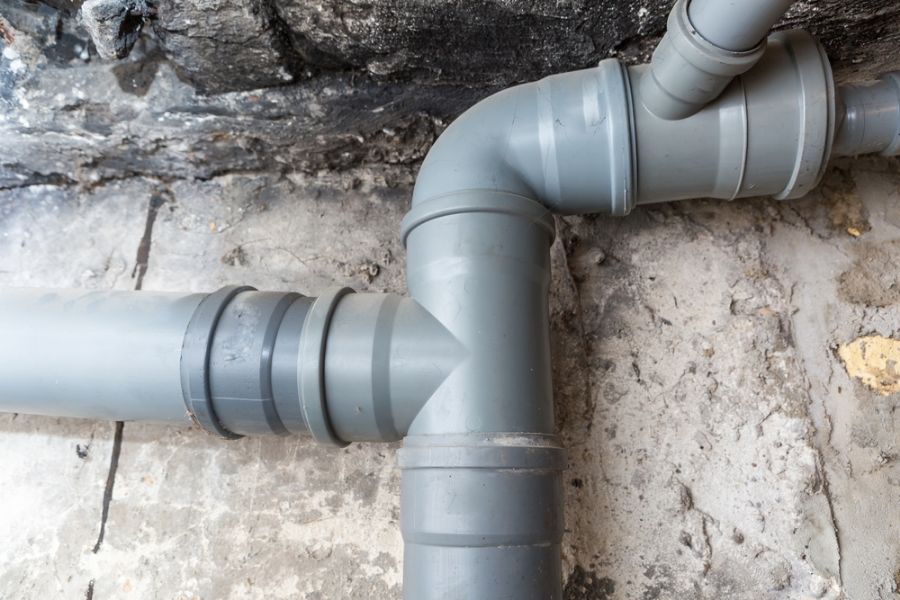 Gray Sewer Pipes in a Basement or Crawl Space