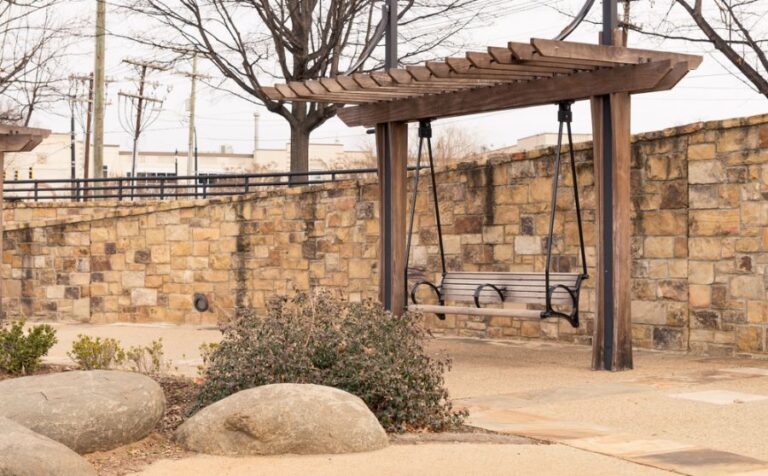 Pergola With a Swing in a Park