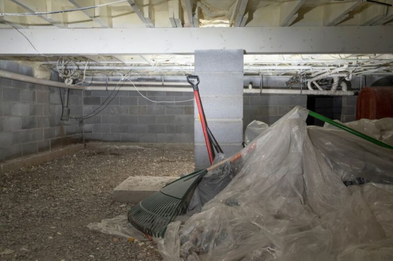 Crawl Space Filled With Plastic Sheeting and Garden Tools