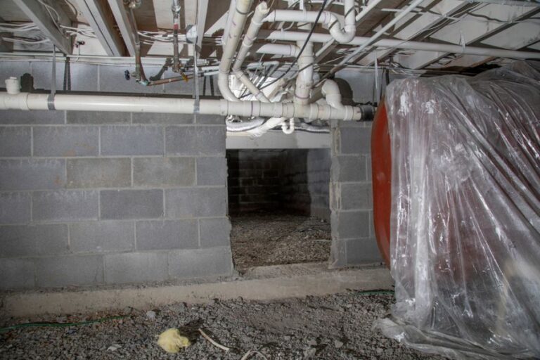 Crawl Space With Pipes and Oil Tank