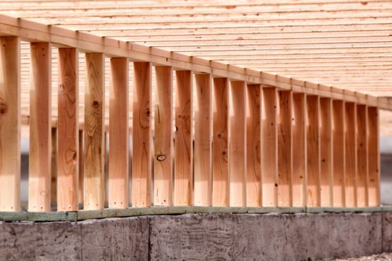 Engineered Wood Floor Joists Spanning the Length of a Crawl Space