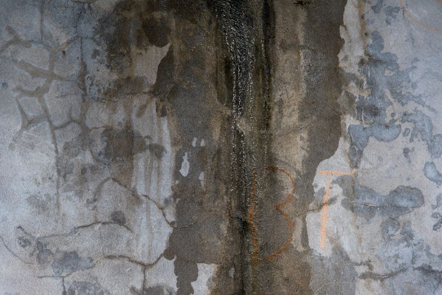 Water Trickling Down the Corner of Two Concrete Walls