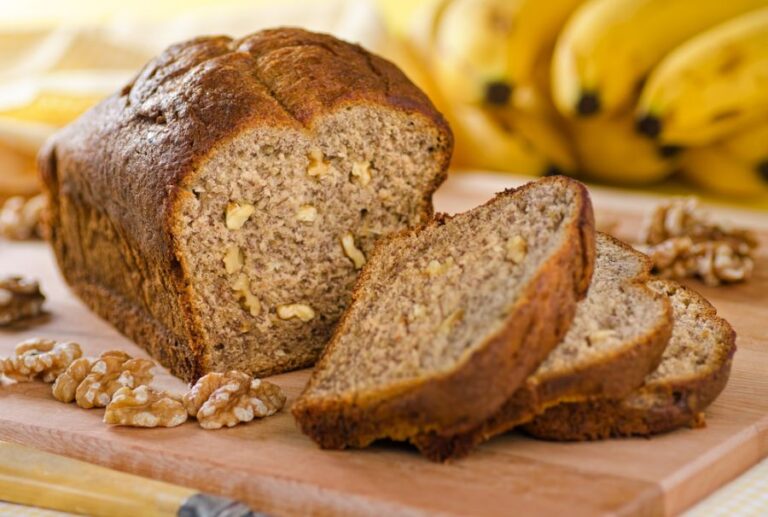Fluffy Banana Nut Bread Sliced on a Cutting Board