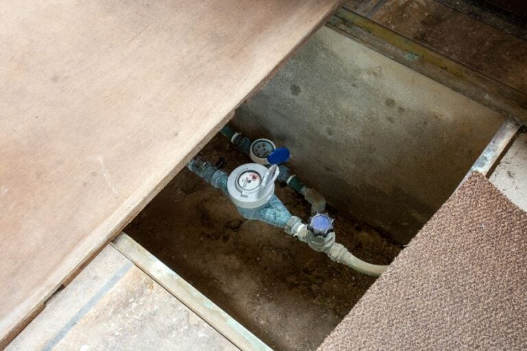Water Meter and Pipes Located in a Crawl Space