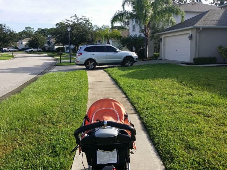 Sidewalk Blocked by a Vehicle in a Driveway