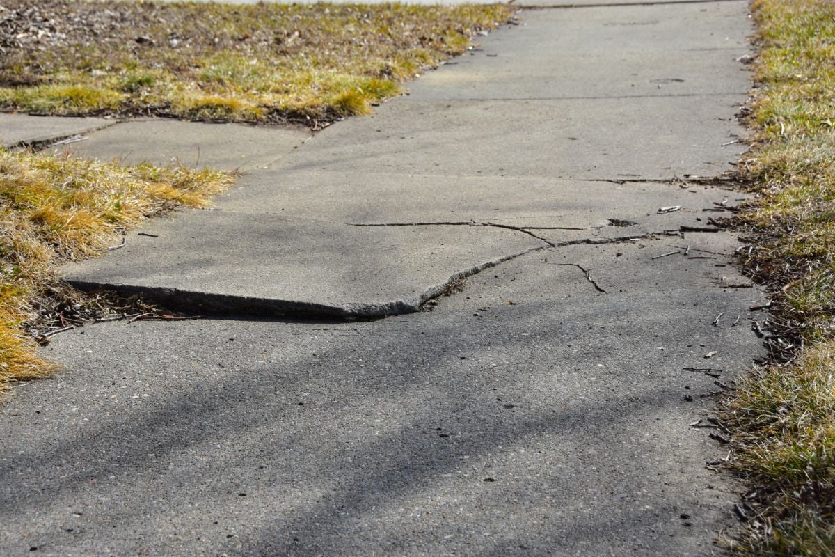 Cracked Sidewalk in Front of House